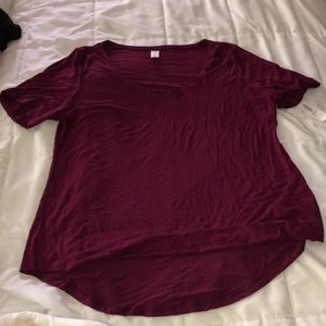Women’s maroon shirt.